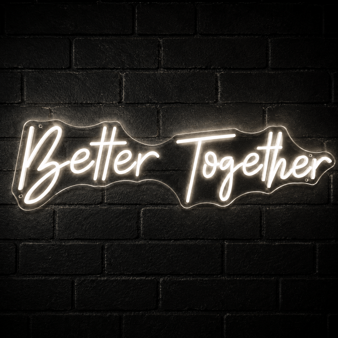Better Together LED neon sign in warm white mounted on a dark black brick wall