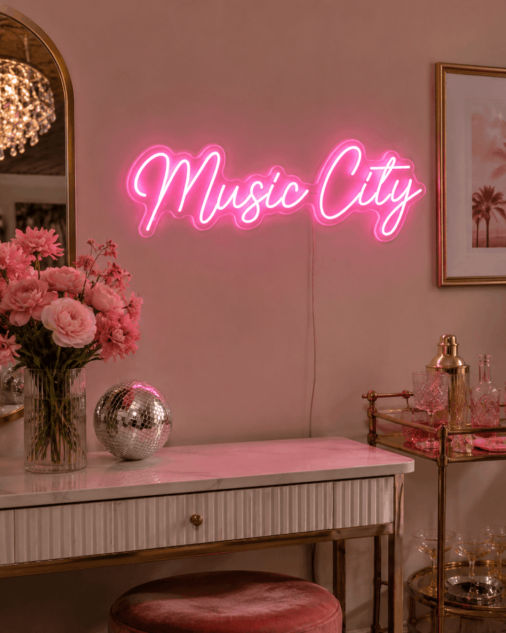 Hot pink Music City LED neon sign in a feminine Nashville-inspired room