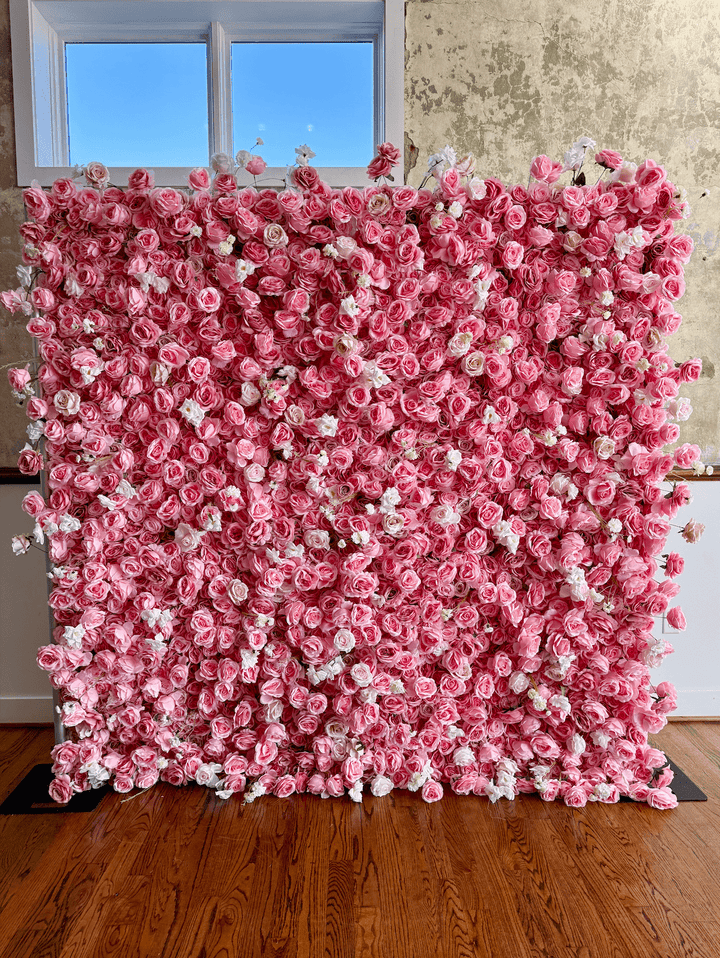 Front view of the 8x8ft pink rose and white carnation 3D silk flower wall backdrop installed indoors