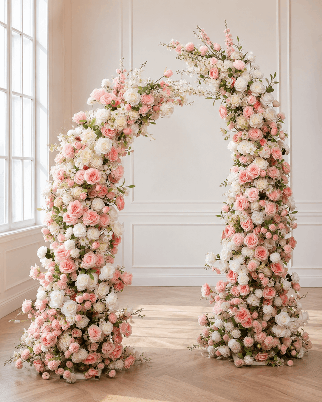 Pink and white silk faux floral arch with roses and greenery for weddings, ceremonies, and event backdrops